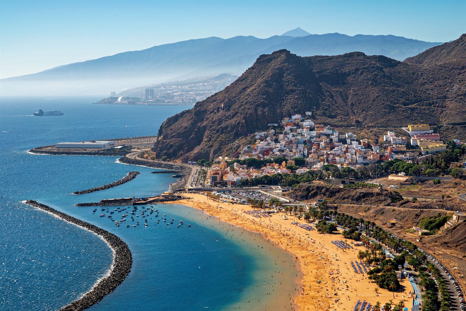 Tenerife coastline with a golden beach and harbor